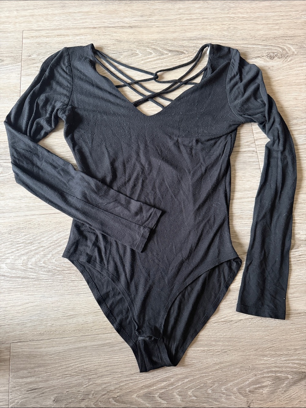 JustFab Black Long Sleeve V-Neck Crisscross Strap Bodysuit